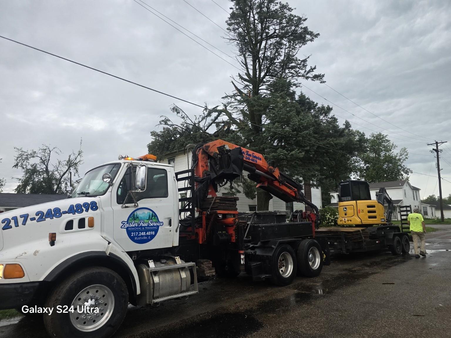 Zeisler Tree Service crane truck and mini excavator ready for tree work